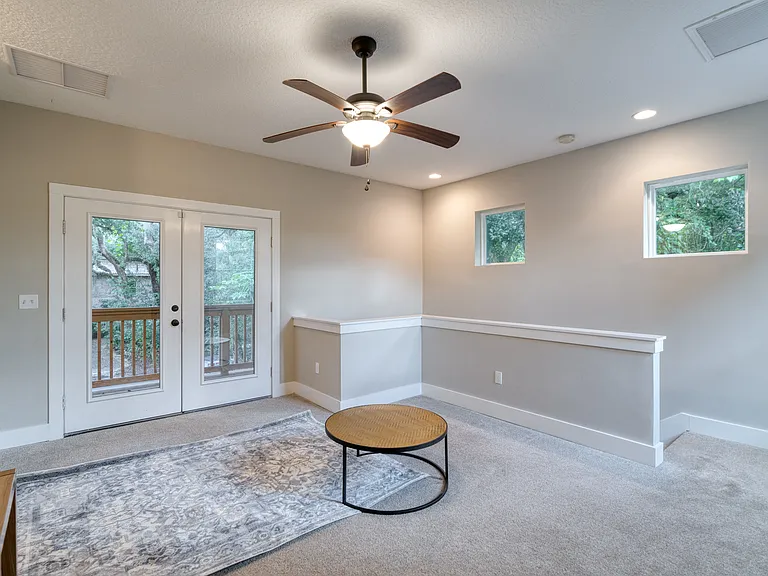 Bright and airy upstairs media lounge with ample seating_the perfect breakout space for families including a sleep sofa for extra guest