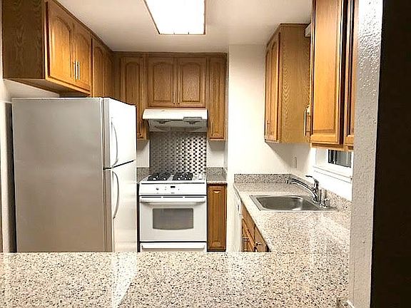 Upgraded bright kitchen with granite countertops