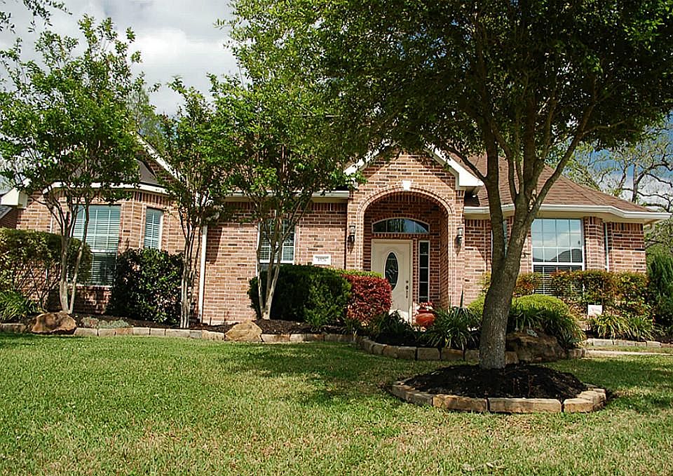 Lush Landscaping all the way around the home.