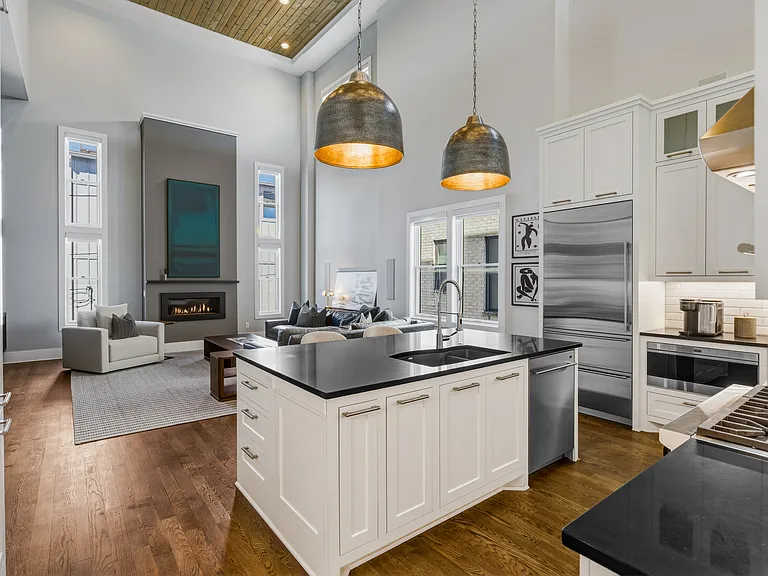 The chef's kitchen boasts a massive island, pantry wall, Wolf steam & convection ovens, a 6-burner 36" gas range and Sub-Zero refrigerator. Everything you need to cook at home, plus island seating and a dining table/room.