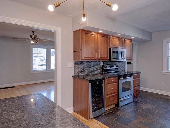 Stainless steel appliances and wine fridge in kitchen