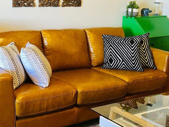 Living room w/ leather couch