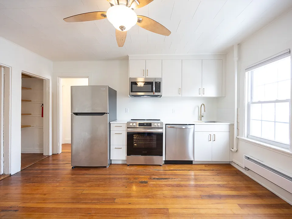 Open kitchen and living space with new appliances