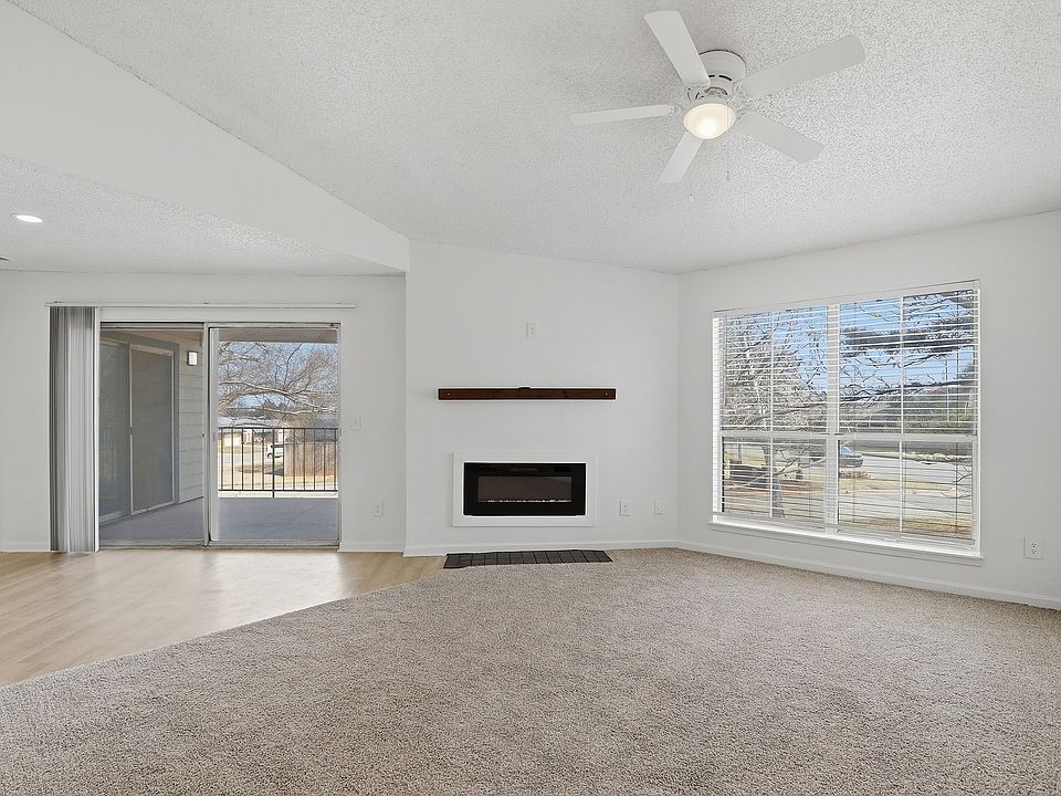 B2 - Two Bedroom Two Bathroom living room with electric fireplace and large patio access.