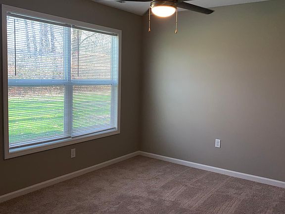 Master bedroom includes a ceiling fan
