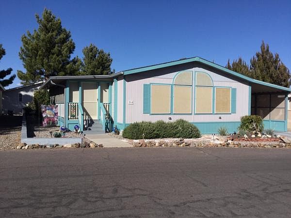 Front of home w/ SUN SHADES