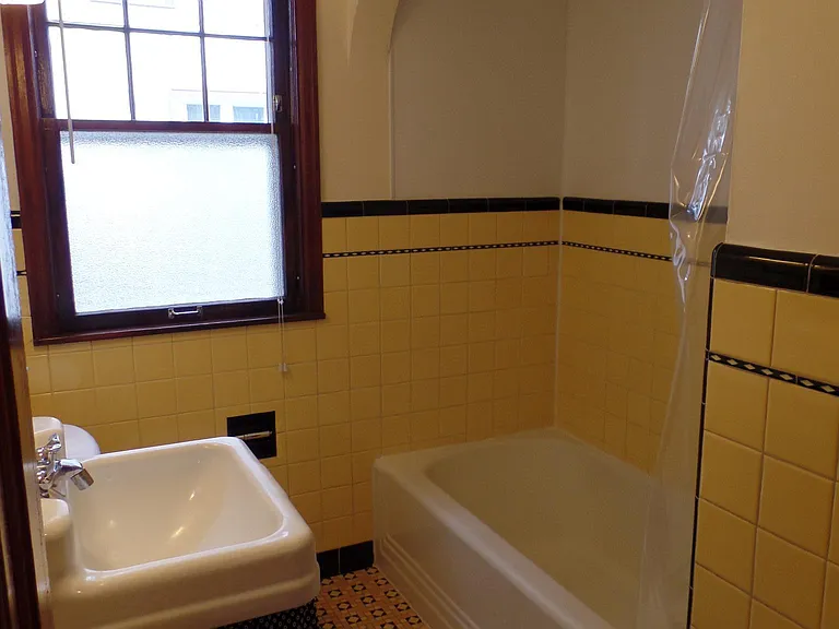 Original 1930s tile. Laundry shoot, shower and bath combo.