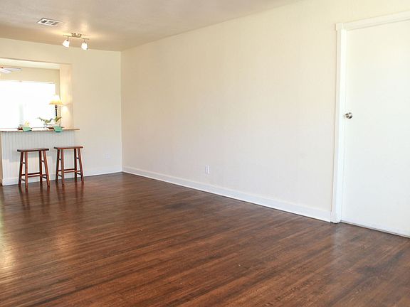 Open kitchen & living, garage entry.