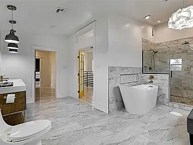 Master bathroom, looking into walk through closet