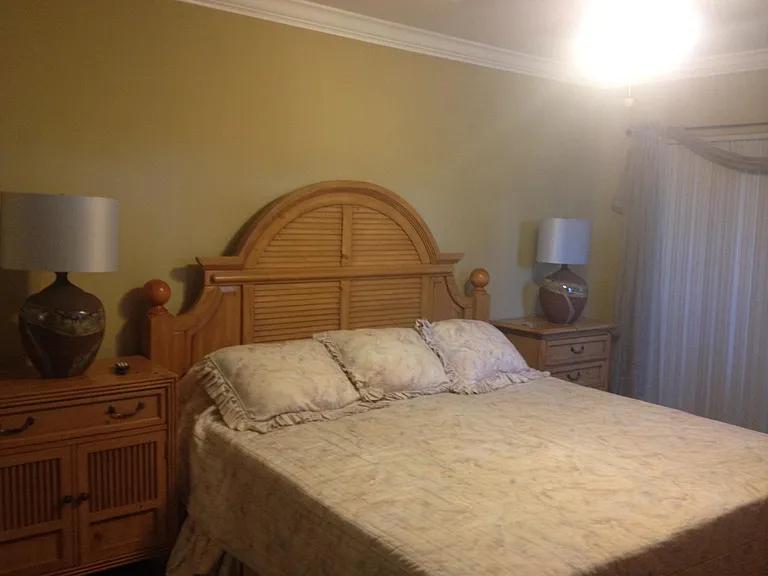 Master room has king bed set with two nights stands, dresser and TV chest