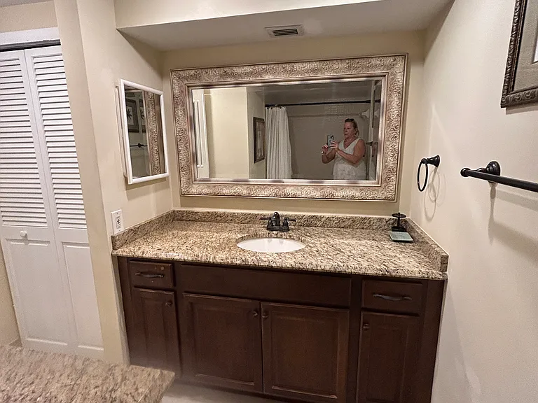 2nd bathroom with large granite top cherrywood cabinet, lots of storage