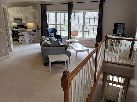 Main living area with view of stairs leading up from ground level