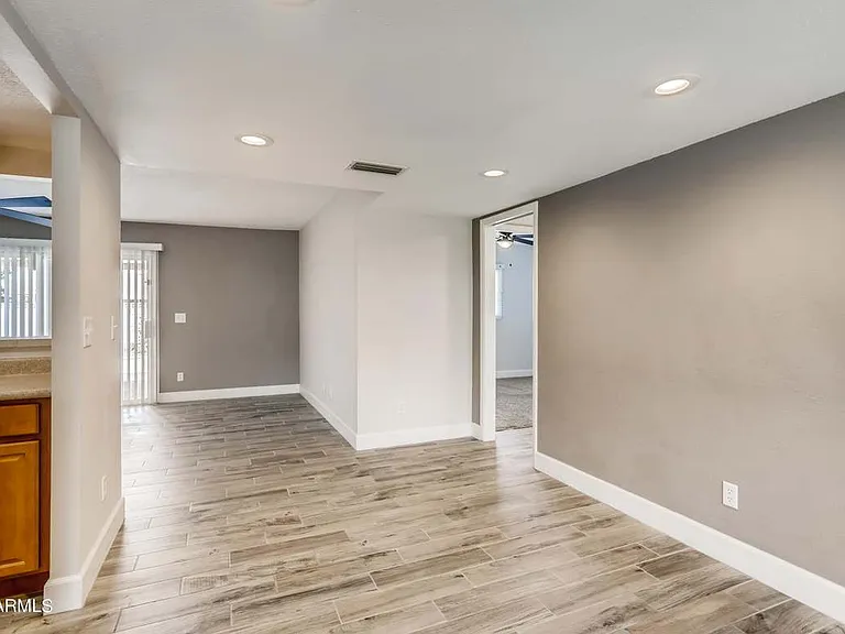 Off kitchen dining room with both recessed lights & lots of natural light.