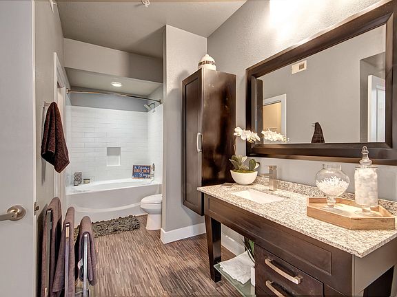 Large Bathroom with Granite Countertops and Soaking Tub in Select Units