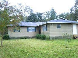 This the main house. Beautiful trees and grass surround it.