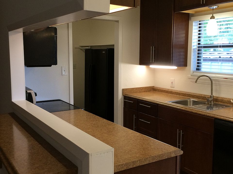 Nice galley kitchen with fridge. The washer/dryer connections are in laundry room.