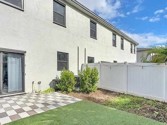 Enclosed backyard, outdoor benches for relaxation