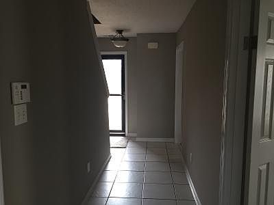 Hallway to the front door. 2 bedrooms and bath are located on this side.