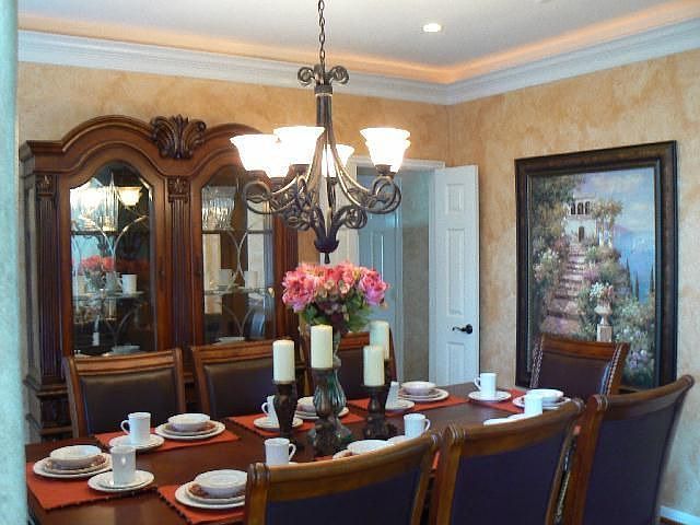 Formal dining w/rope lighting and plantation shutters