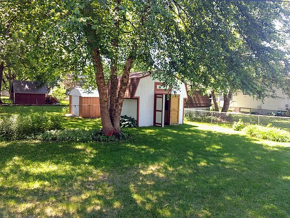 Huge storage shed in backyard also has a workshop inside