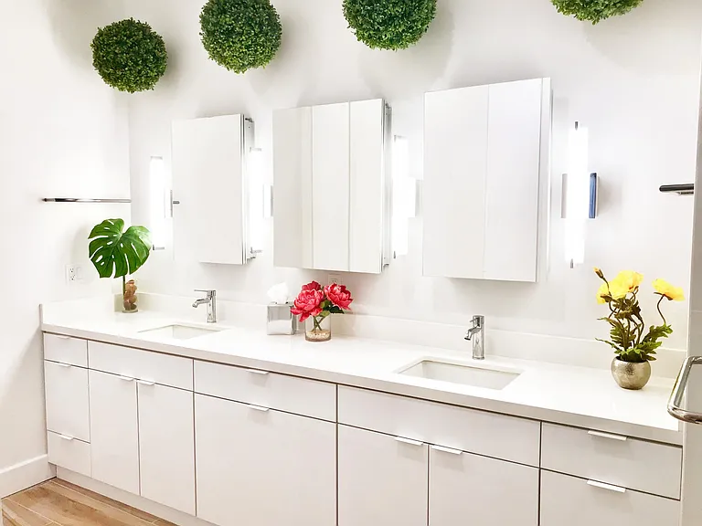 Master Bathroom/Spa with hidden Laundry cabinet, custom "hairstylist" drawers, special LED tube lights for vanity & getting ready, and 3 oversized medicine cabinets with ample room for quick-reach toiletries. Not seen in picture: built-in double storage f