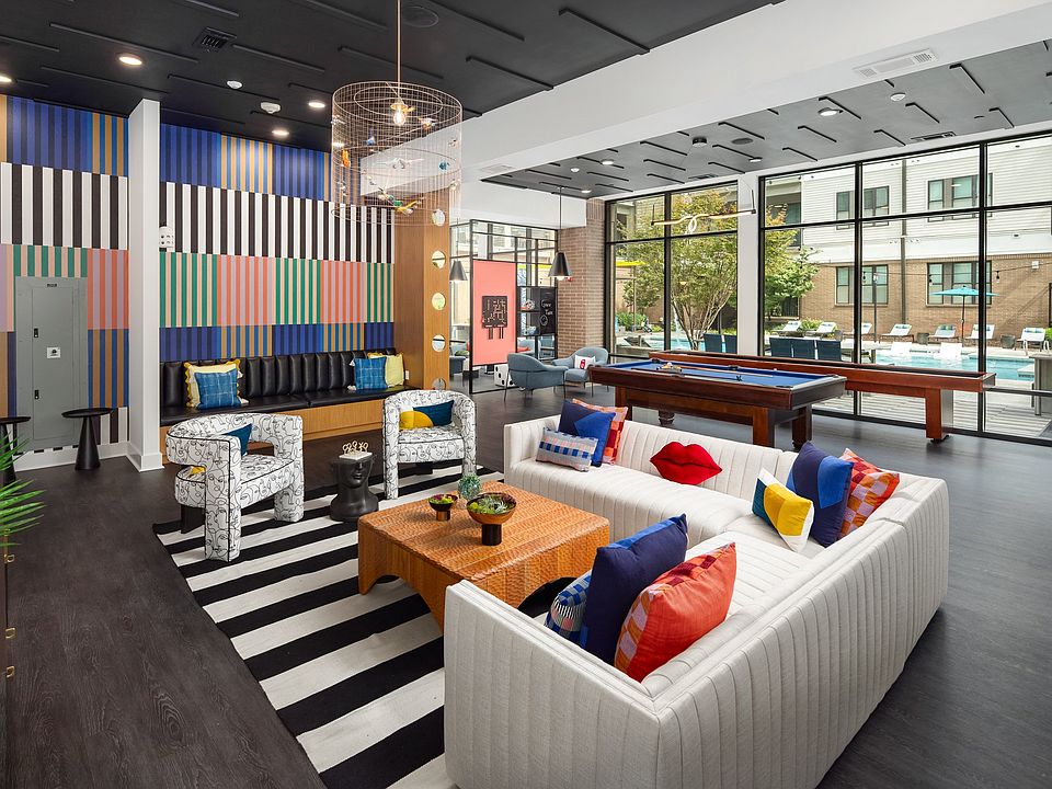 Resident Social Space Featuring Lounge Seating, Billiards, and Colorful Decor
