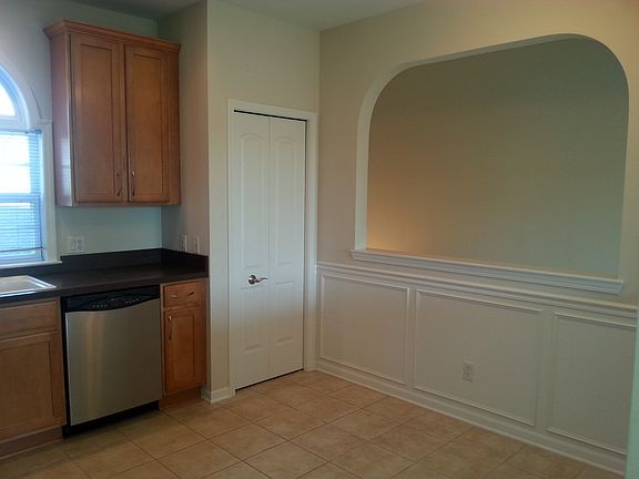 Wainscoting in kitchen, entryway and stairs