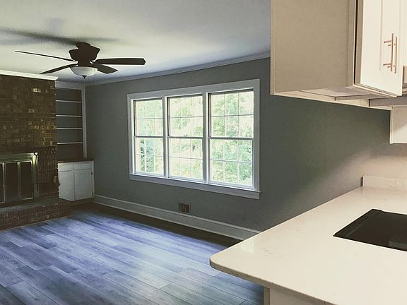 Family room from kitchen. All new floors. Counter overhang at left into family room.