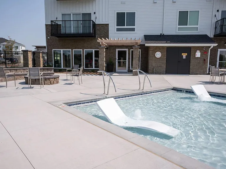 Luxury pool with seating at The Harbor.