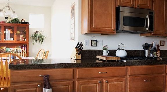 Notice the beautiful granite tile kitchen