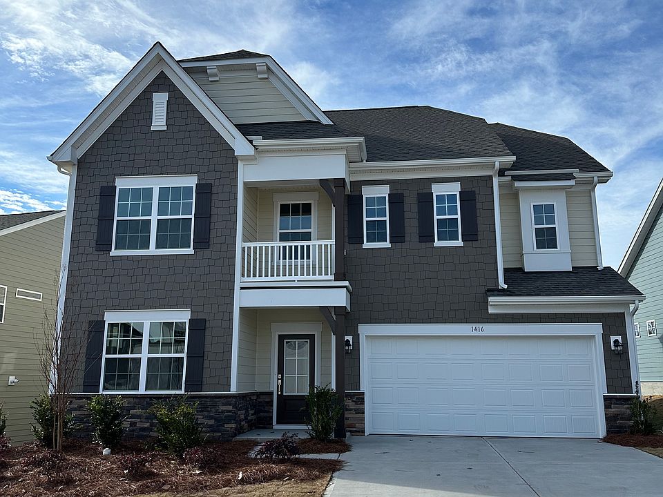 Front view with driveway