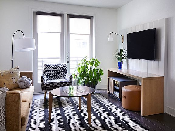 Designer-Furnished Apartment Suites Include a 55" Flatscreen Smart TV with Complimentary WiFi