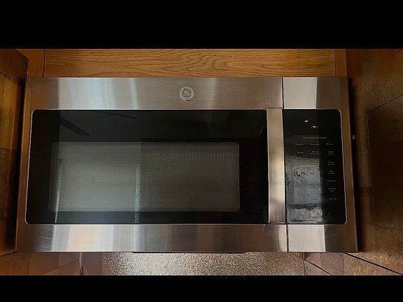 Kitchen: 1 stove, a built-in stainless steel General Electric microwave (07/25), and 2 fridges for renters' use: Frigidaire (beige, semi-used) and General Electric brand new closed box item, stainless Steel. Both include an ice maker and water dispenser.