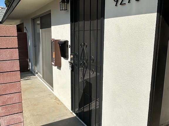 Entryway to 9270. 

Security Screen Gate Front Door. Brand New Unit Numbers and New Secured Mailbox.