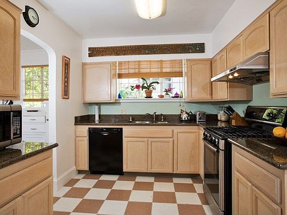 Kitchen, with laundy and half bath nearby