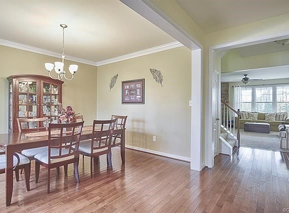 Entry Hall to dining room--offering hardwood floors, crown moldings and neutral colors