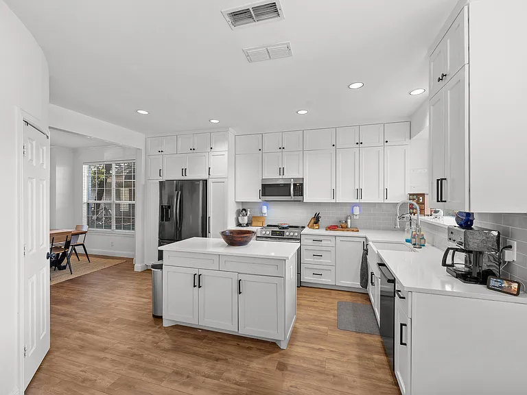 Clean, welcoming kitchen with modern appliances and plenty of counter space.