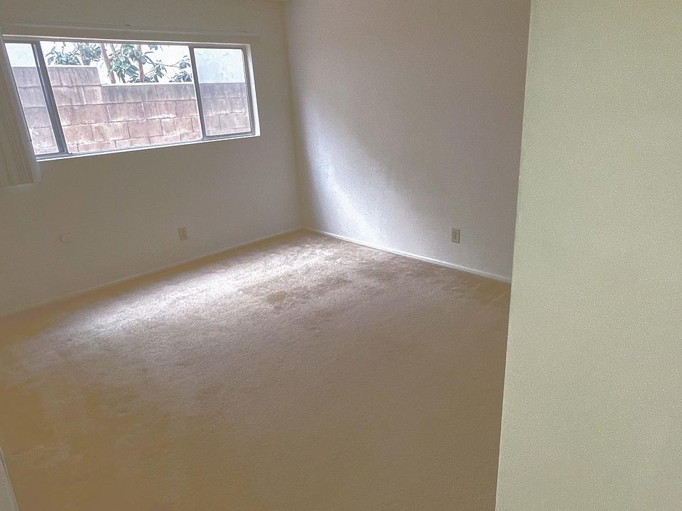 Bedroom with natural light, block wall creates privacy