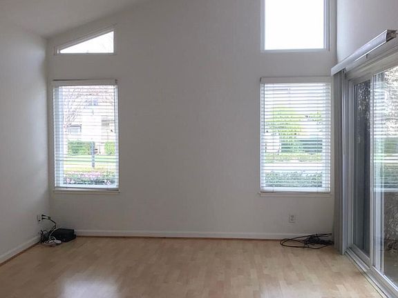 Light filled Living room with high ceilings and wood flooring