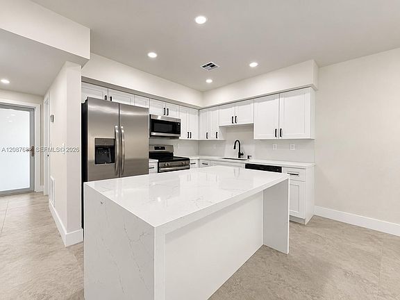 3rd image of 7164 W 3rd Ave