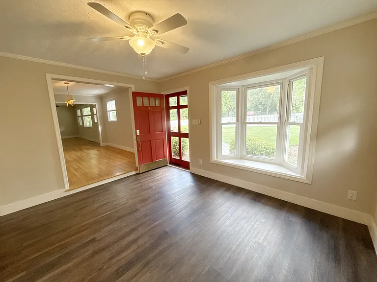 Living room with dining room/family room through doorway