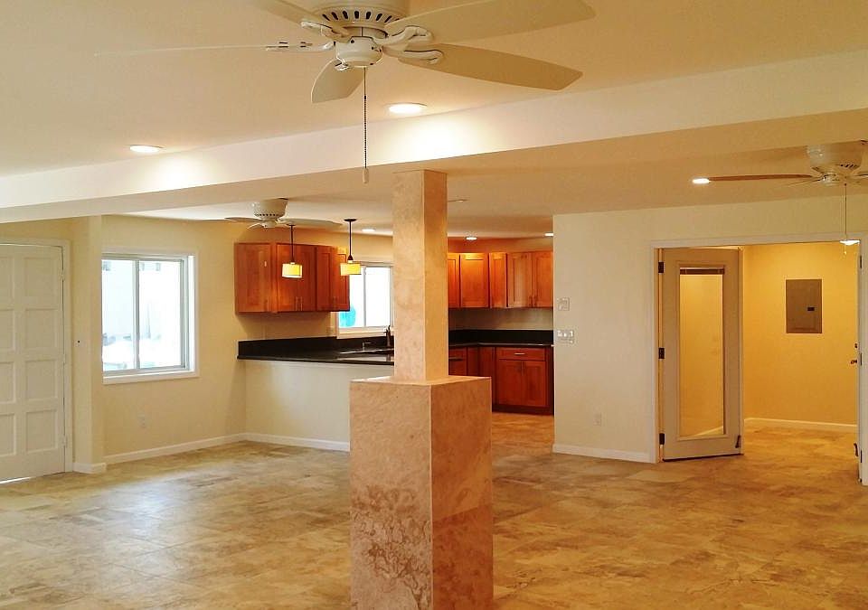 Open living space - kitchen, dining, and living area flow to
