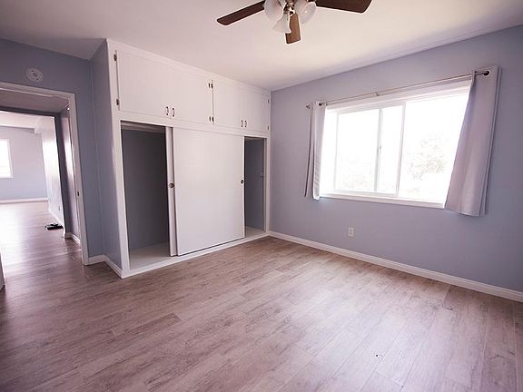 Bedroom A showing ample closet space and ceiling fan. Lots of bright light.