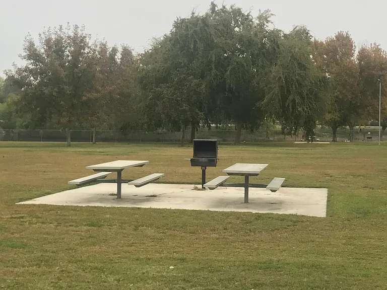 Picnic table and BBQ at city park one block away