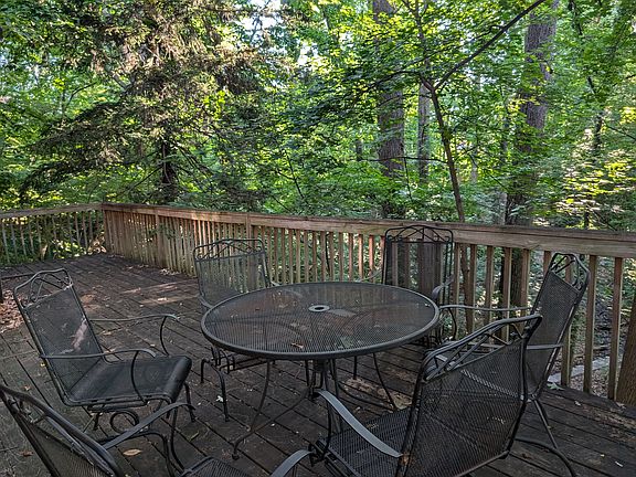 Deck off patio with beautiful views of nature.