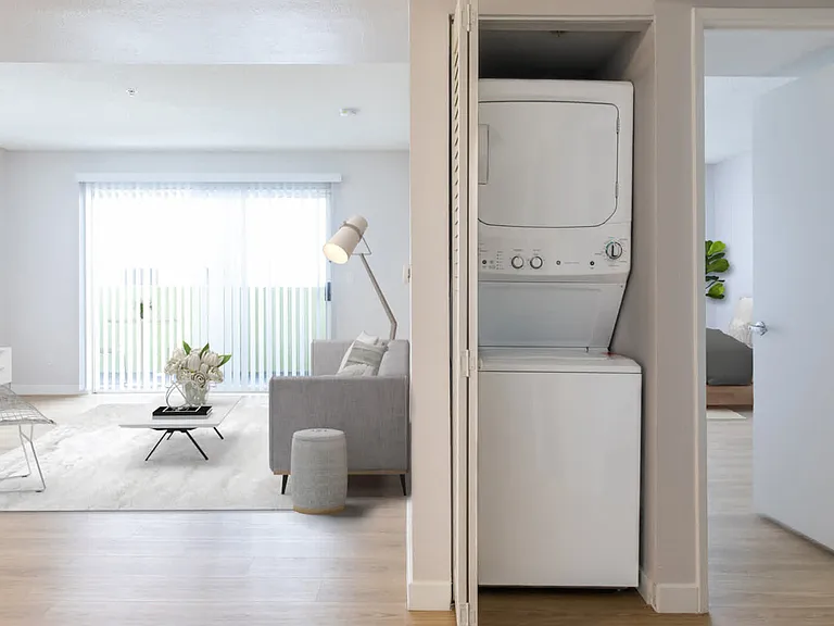 Living Room with Hard Surface Flooring and In-home Washer and Dryer
