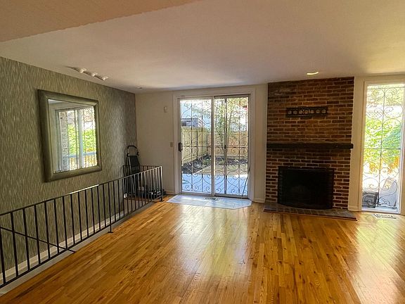 Left stairway to finished basement with laundry room, storage, laundry area and inside entry to garage. Back sliding door leads to private backyard.