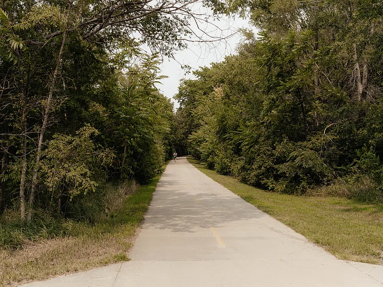 This is Rock Island Trail, directly behind the trees behind the townhome. Just a short walk up the path to the trail...so convenient for your daily walk or run.