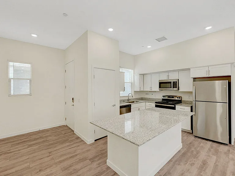 Experience luxury living with this contemporary kitchen design featuring high-end finishes.