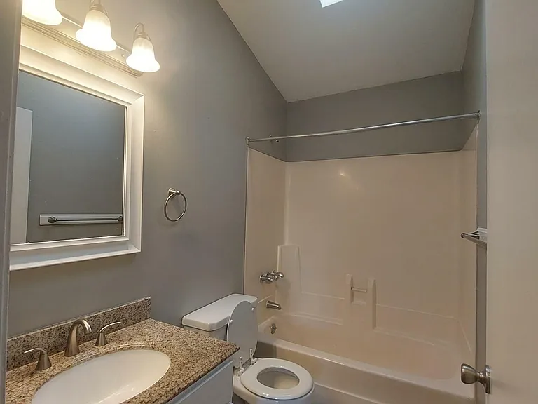 Spacious Full Bath + Skylight, Modern Cabinets, Granite Counter Tops, Modern Lighting